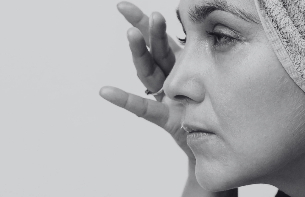 Side profile of woman with dull, tired-looking skin